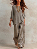 Two-piece Set Featuring A Relaxed-fit Knit Top And Glossy Trousers.